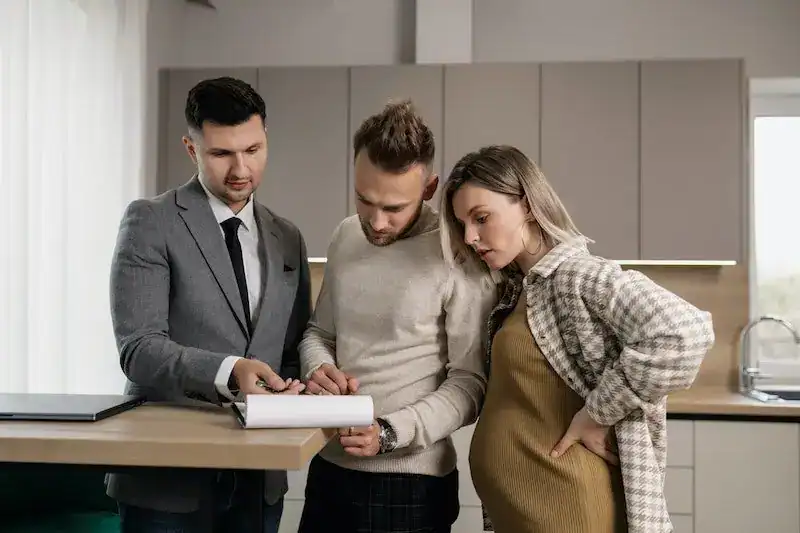 property manager discussing real estate laws with tenants