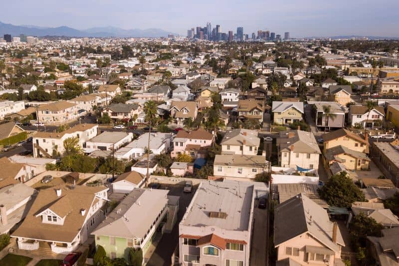 Aerial view of a Los Angeles residential neighborhood with the downtown skyline