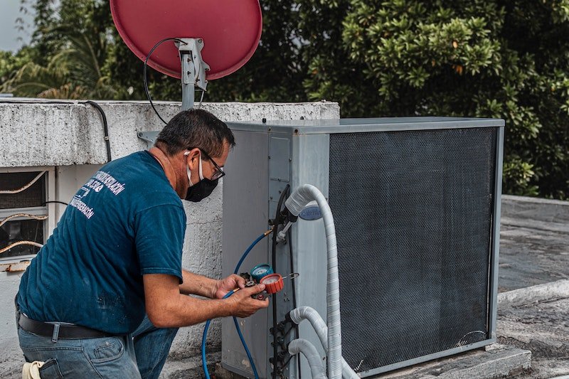 Landlord and tenant discussing an air conditioning repair timeline