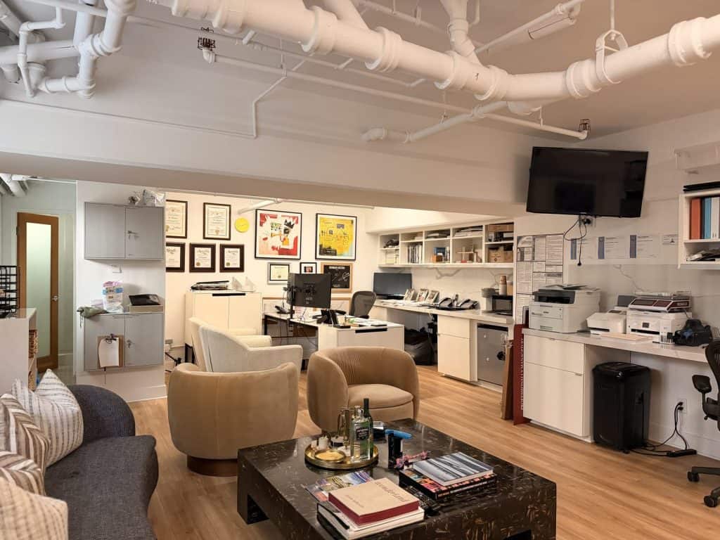 The open-plan Lotus West Properties office in Los Angeles with desks and lounge seating